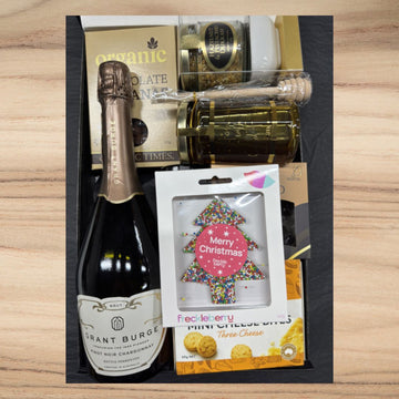 Christmas gift box with Grant Burge sparkling wine, organic chocolate, honey jar, and festive tree chocolate