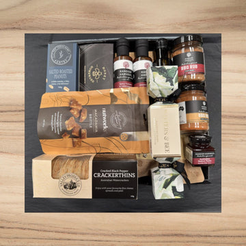 Gourmet gift box with salted peanuts, macadamia brittle, BBQ rubs, crackerthins, honey, and quince paste