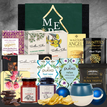New Zealand gourmet hamper with Whittaker's chocolate, Trentham Tucker wafers, Pukka teas, Hunter's chips, Ashgrove truffle snacks, and preserves