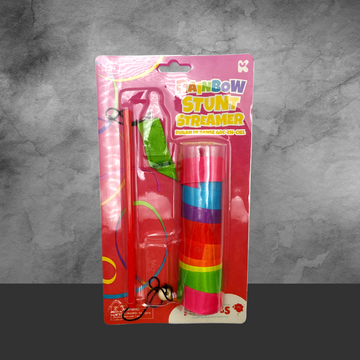Rainbow Stunt Streamer toy with rainbow-colored ribbon and red handle in pink packaging