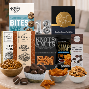 Celebrate an 18th birthday with the Snacking Combo Hamper from Tastebuds, featuring sweet and savoury treats, gourmet snacks and a free personalised card.