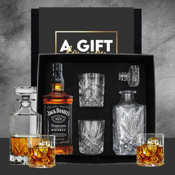 Jack Daniel's whiskey gift set with glasses and decanter on a gray background