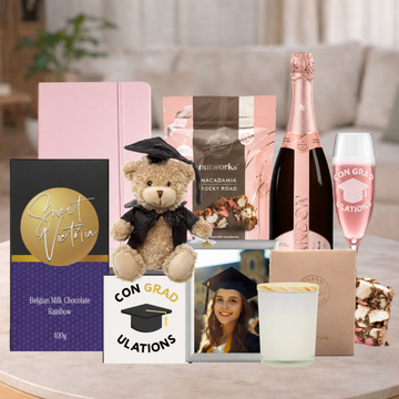 Graduation Congrats Hamper with sparkling wine, graduation glass, teddy bear, candle, chocolates and keepsakes