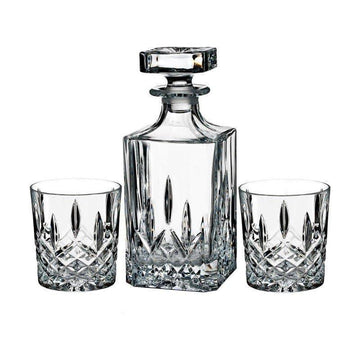 Crystal decanter and two glasses on a white background