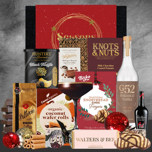Assorted gourmet food and drink products on a gray background