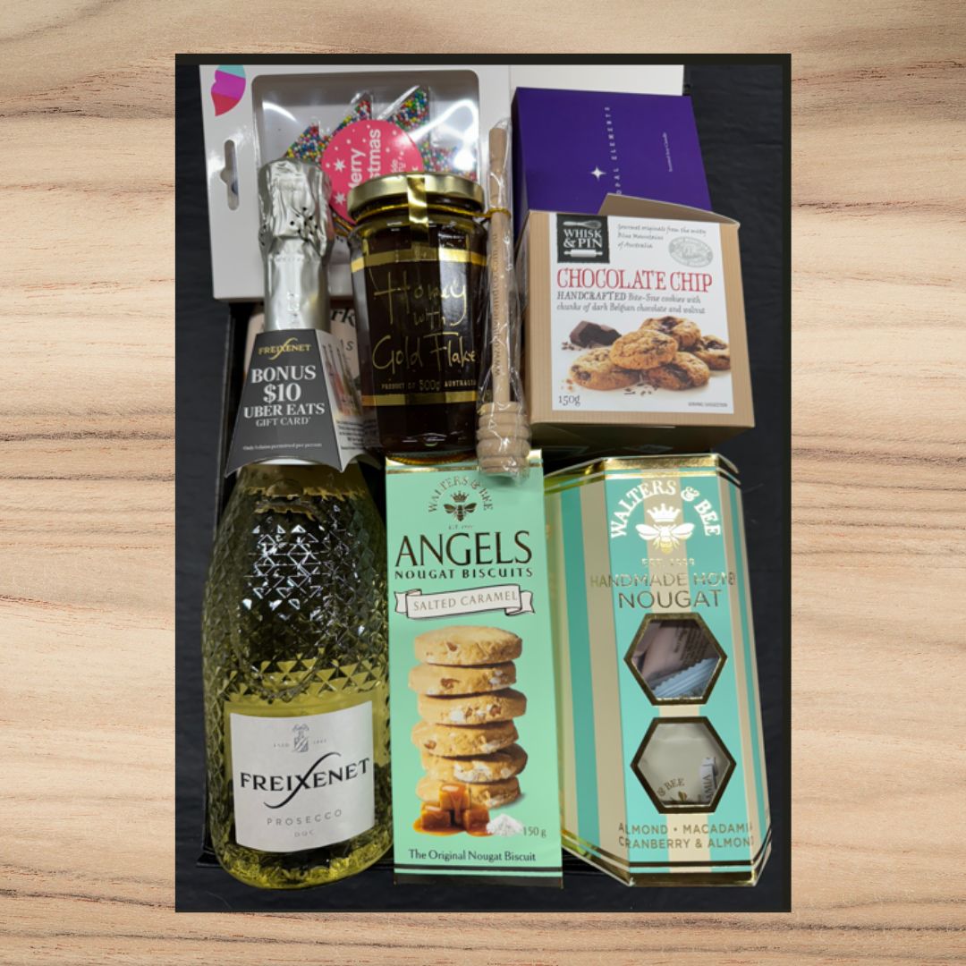 Gift set with Freixenet Prosecco, honey with gold flakes, chocolate chip cookies, salted caramel nougat biscuits, and handmade nougat