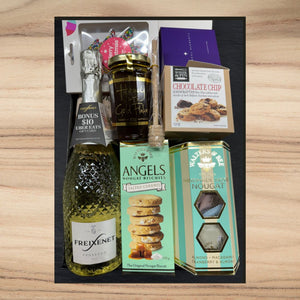 Gift set with Freixenet Prosecco, honey with gold flakes, chocolate chip cookies, salted caramel nougat biscuits, and handmade nougat