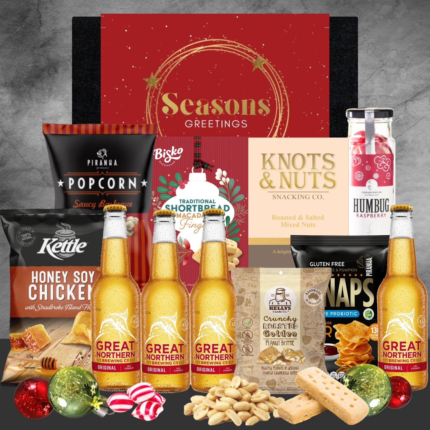 Holiday gift box with Great Northern beers, popcorn, shortbread, mixed nuts, potato crisps, raspberry humbug sweets, and peanut brittle
