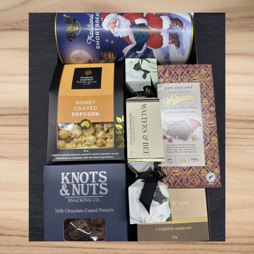 Gift box with traditional shortbread, honey coated popcorn, milk chocolate pretzels, jasmine nougat, plum chocolate, and nut mix