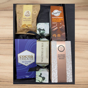 Gift box with Kelly's peanut brittle, Charlie's choc & salty caramel, cocoa treats milk chocolate, Walters & Bee nougat, and raspberry white choc biscuits