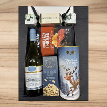 Gift box with wine, honey soy chicken chips, salted roasted peanuts, traditional shortbread, and Walters & Bee chocolate