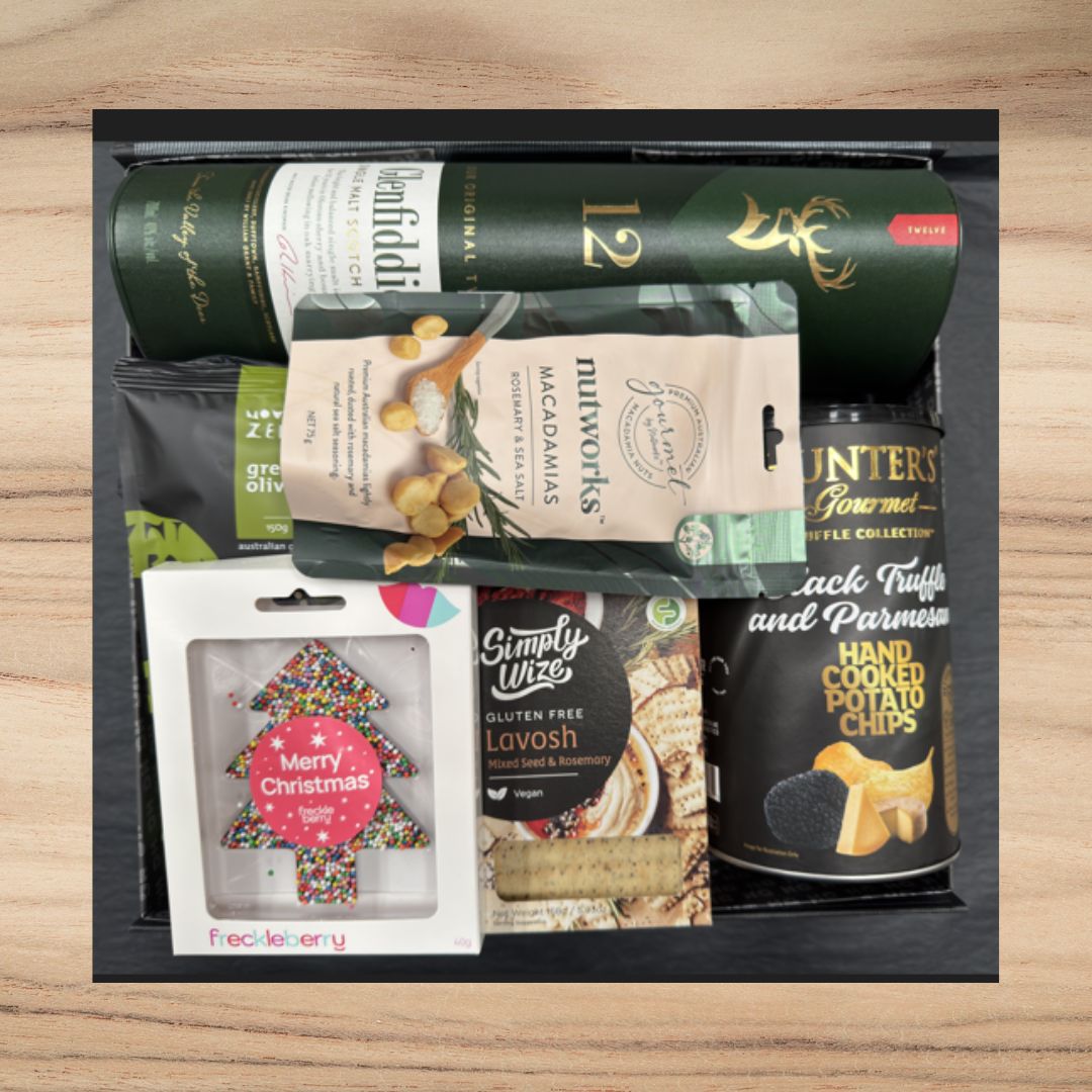 Christmas gift box with Glenfiddich whisky, macadamia nuts, truffle potato chips, gluten-free lavosh, and festive tree cookie