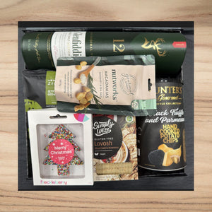 Christmas gift box with Glenfiddich whisky, macadamia nuts, truffle potato chips, gluten-free lavosh, and festive tree cookie