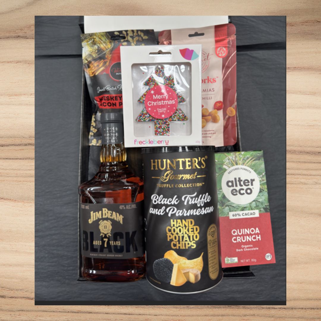 Gift box with Jim Beam Black whiskey, Hunter's Gourmet black truffle chips, Alter Eco quinoa crunch chocolate, and festive treats