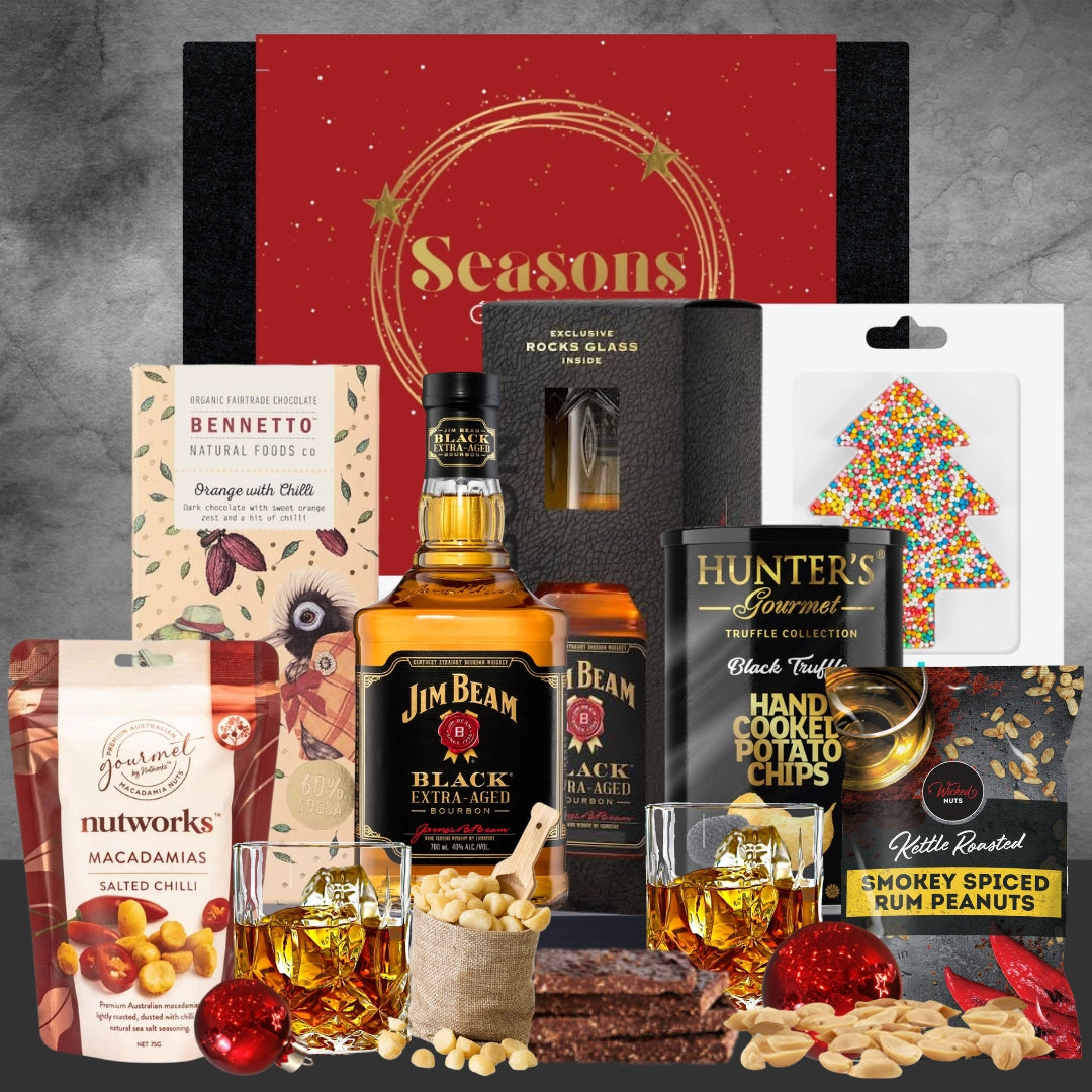 Holiday gift box with Jim Beam bourbon, macadamia nuts, dark chocolate, spiced peanuts, truffle chips, and festive treats