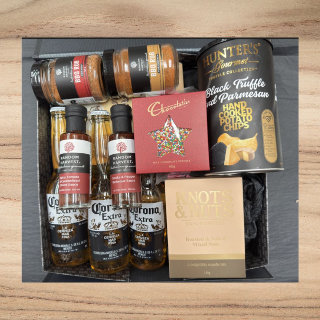 Gift box with Corona beer, BBQ rubs, Random Harvest sauces, Hunter's truffle potato chips, chocolate, and roasted mixed nuts