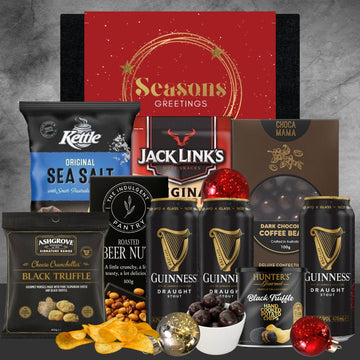 Holiday gift box with Guinness stout cans, black truffle chips, Kettle sea salt chips, roasted beer nuts, Jack Link's meat snacks, dark chocolate coffee beans