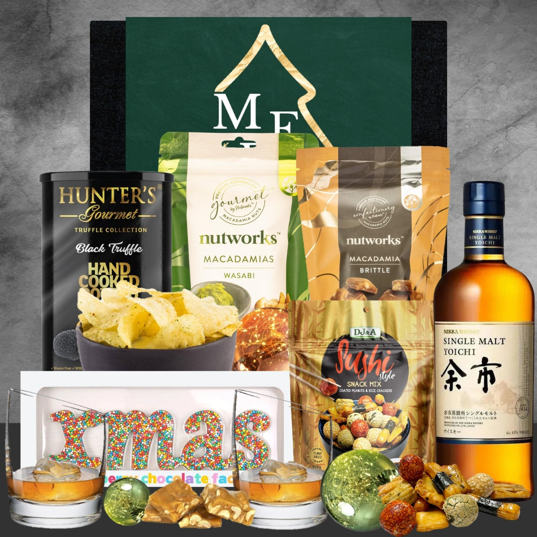Gourmet gift basket with Hunter's truffle chips, Nutworks wasabi and brittle macadamias, sushi snack mix, Nikka Single Malt Yoichi whisky, festive chocolates and holiday decorations