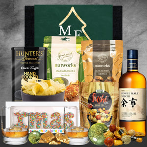Gourmet gift basket with Hunter's truffle chips, Nutworks wasabi and brittle macadamias, sushi snack mix, Nikka Single Malt Yoichi whisky, festive chocolates and holiday decorations