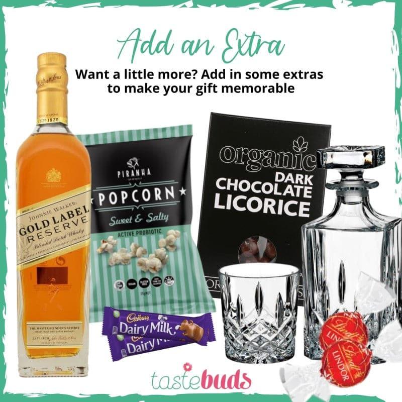 Whiskey bottle, sweet & salty popcorn, dark chocolate licorice, chocolates, and glass decanter with tumbler