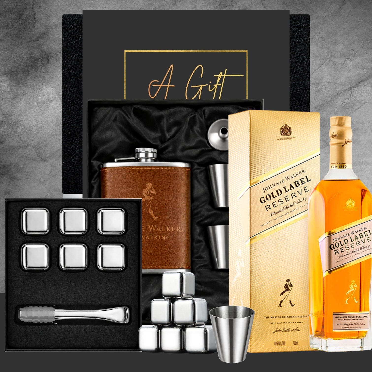 Alcohol gift set with Johnnie Walker Gold Label Reserve whisky, hip flask, and bar accessories on a gray background.