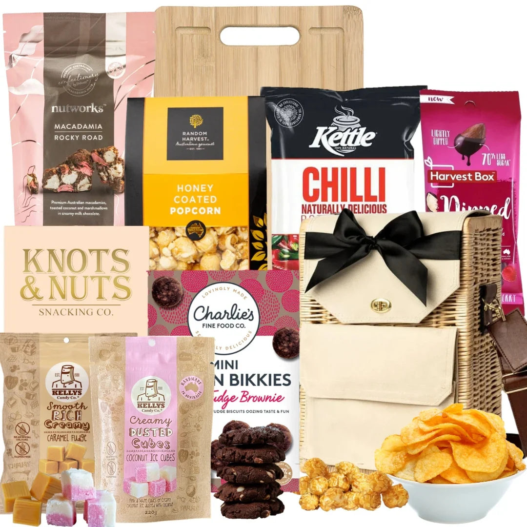 Assorted snacks and treats including popcorn, cookies, and chocolate bars on a white background