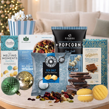 Assorted snacks and treats on a table with a festive background