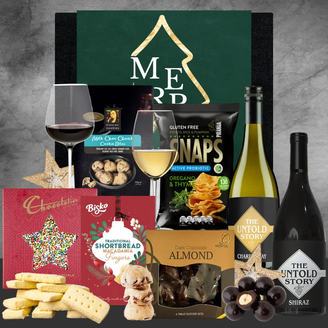 Christmas Gourmet gift set with wine, snacks, and chocolates on a gray background