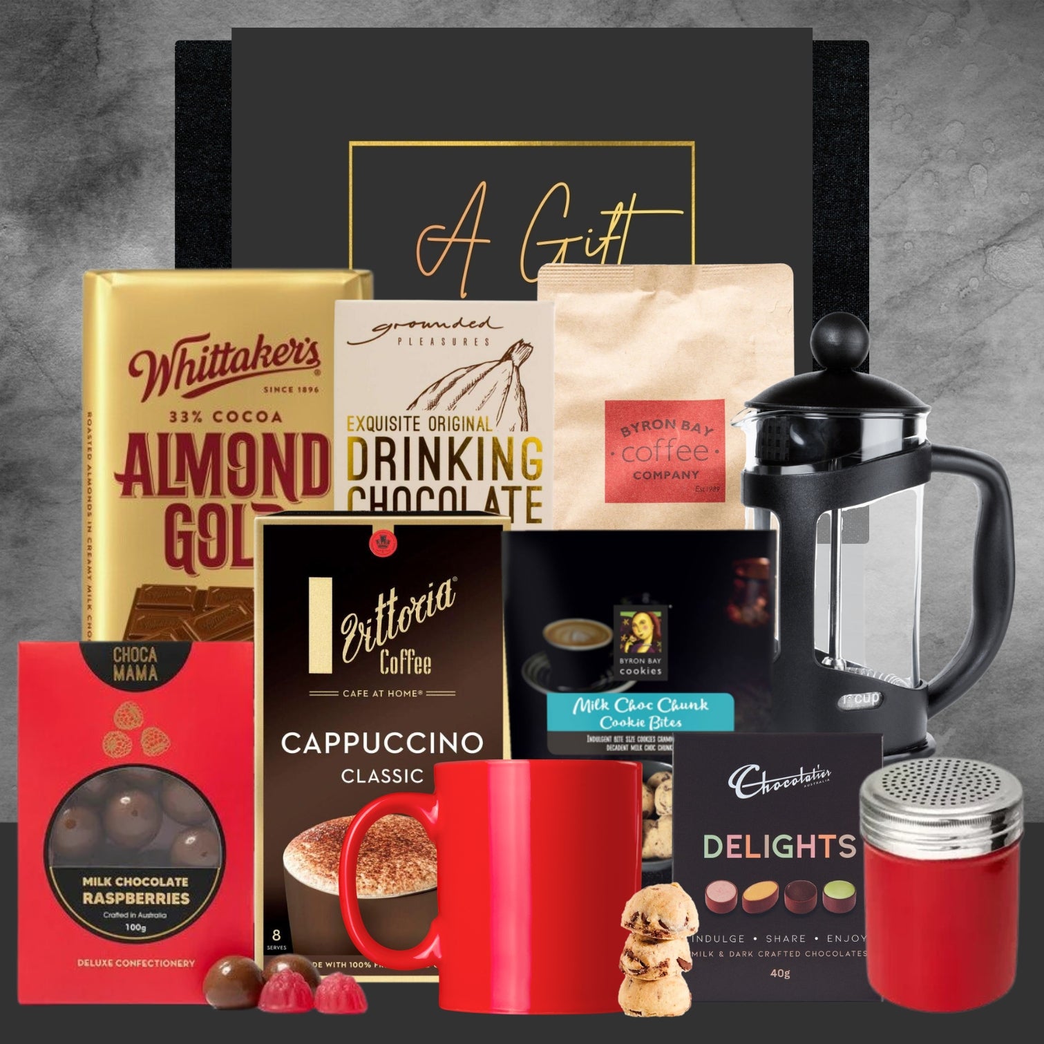 Collection of coffee and chocolate products with a black gift box on a gray background