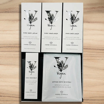 Set of vegan skincare product packaging on a wooden surface