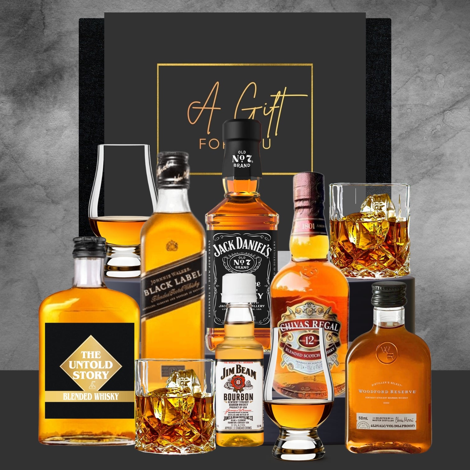 Collection of whiskey bottles and glasses with a 'Gift for You' card on a gray background