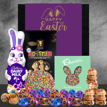 Easter-themed treats including a Cadbury Dairy Milk bunny, colorful cookies, and a 'Happy Easter' card on a gray background.
