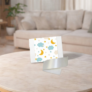 Card with cloud and moon design on a stand in a living room setting