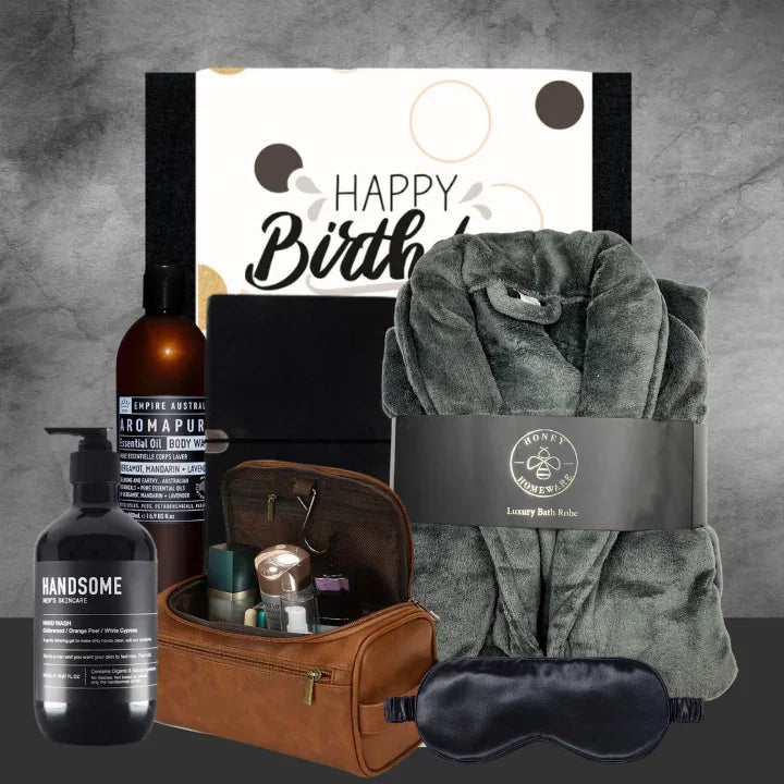 Gift set with bathrobe, sleep mask, and toiletries on a gray background