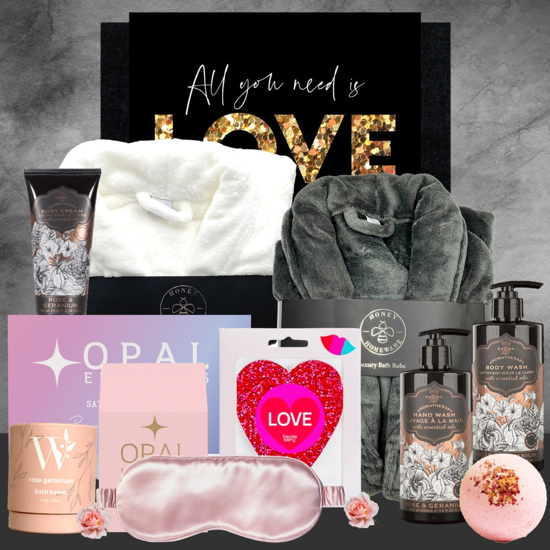 Gifting set with towels, skincare products, and decorative items on a gray background.