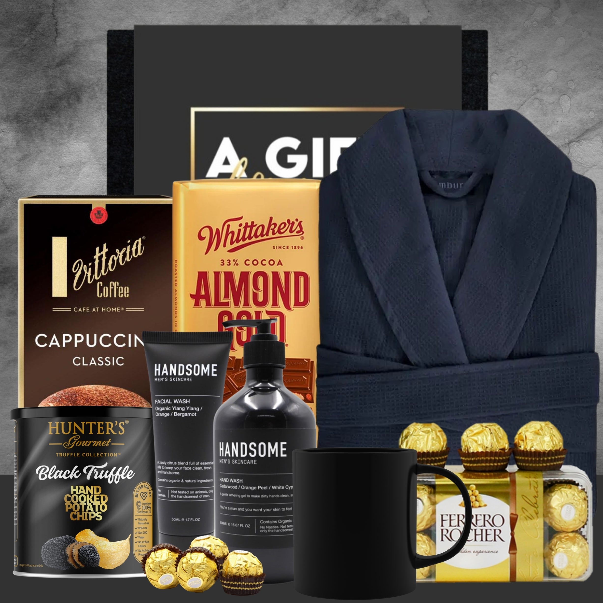 Gourmet gift set with coffee, chocolate, and bathrobe on a gray background