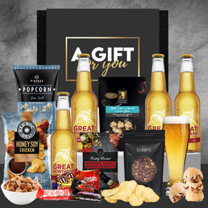 Assorted gift items including beer bottles, snacks, and a 'Gift for You' box on a gray background.