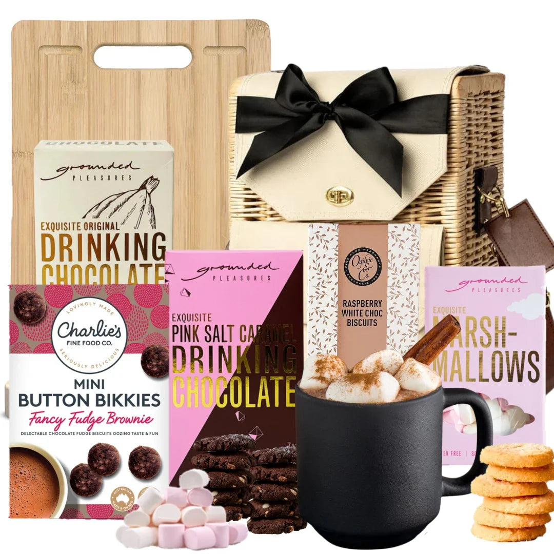 Hot chocolate gift set with a mug, marshmallows, and various packaging on a white background