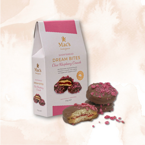 Box of Mac's Shortbread Dream Bites with raspberry crunch on a soft pink background
