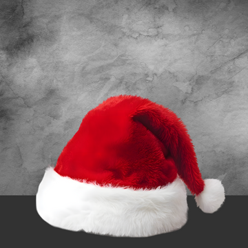 Red and white fluffy Santa hat against gray textured background