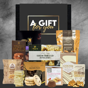 Collection of various food items and packaging with a 'Gift for You' box on a gray background.