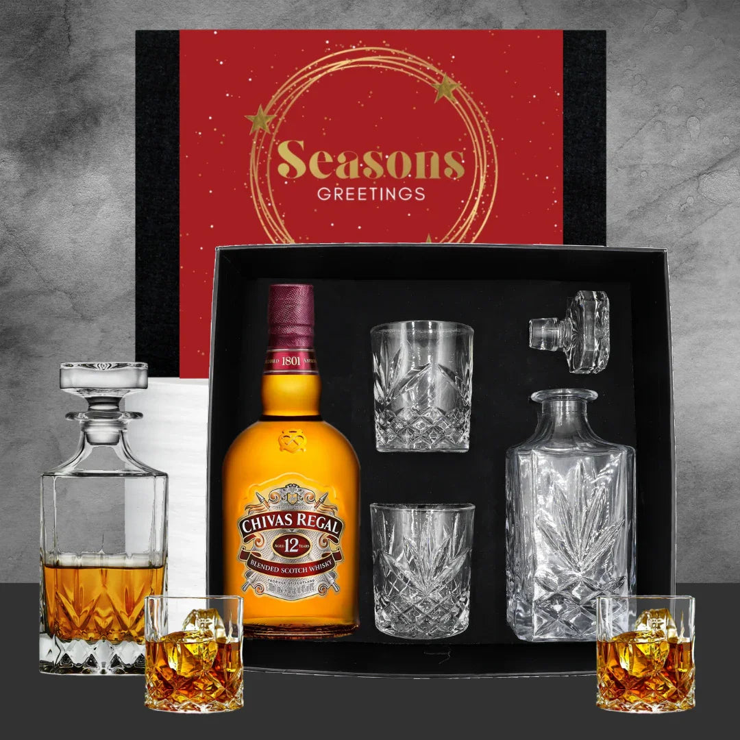 Chivas Regal whiskey set with glasses and decanter in a 'Seasons Greetings' box.