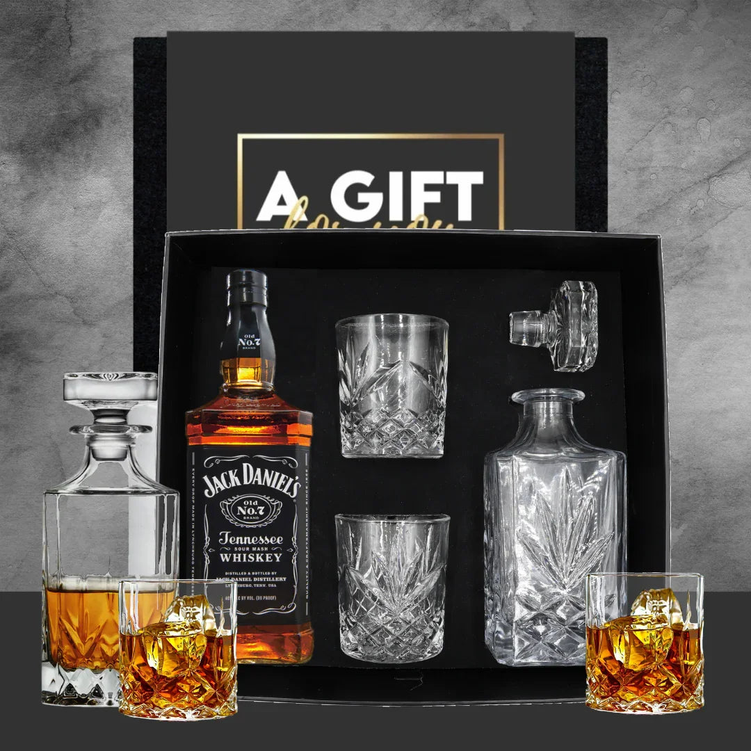 Jack Daniel's whiskey gift set with glasses and decanter on a gray background