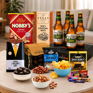 Beer and snack gift hamper for Dad featuring premium beer, cocktail nuts, beef jerky, chips and Father's Day chocolates.