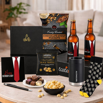 Beer Lovers Gift Hamper for Dad by Tastebuds featuring Father's Day beers, gourmet snacks, beer mug socks, stubby holder and Father's Day chocolates.