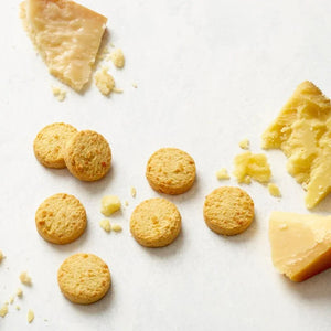 Biscuits with chunks of cheese on a white background