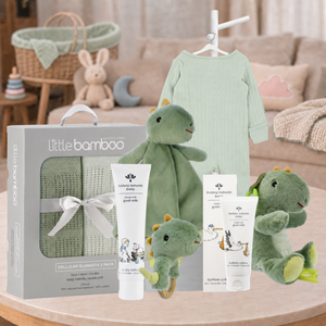 Dino Baby Neutral Hamper with sage baby zipsuit, dinosaur toys, blankets and newborn care essentials