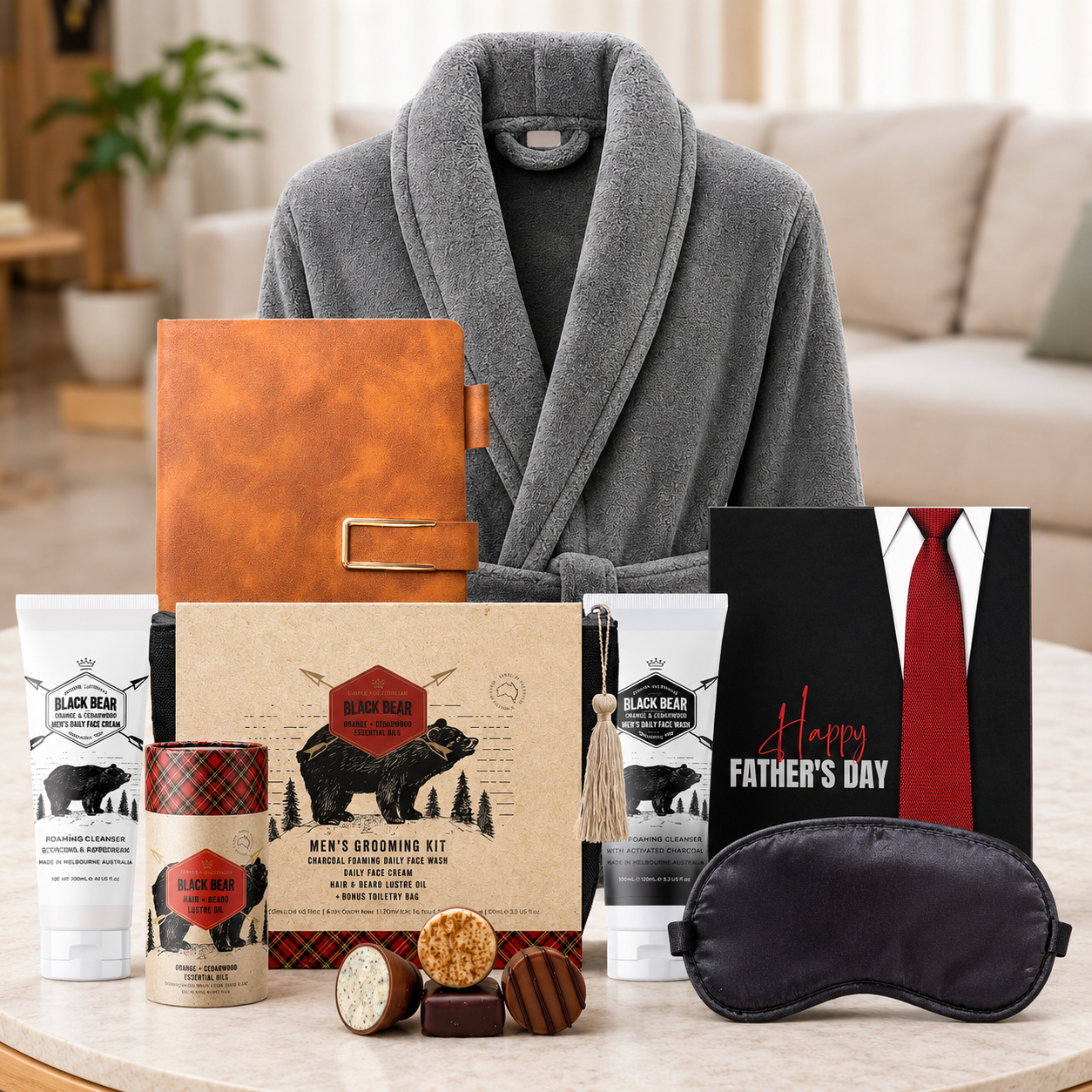 Father's Day Empire Pamper Hamper for Dad by Tastebuds featuring a luxury grey bathrobe, grooming set, leather notebook and Father's Day chocolate.