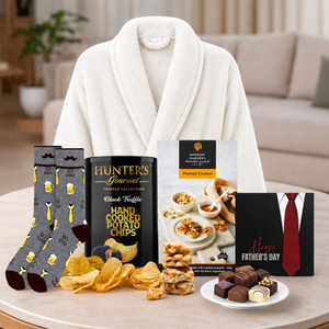 Premium Father's Day pamper hamper featuring a luxury bathrobe, gourmet treats, Father's Day chocolates and cosy Dad socks.