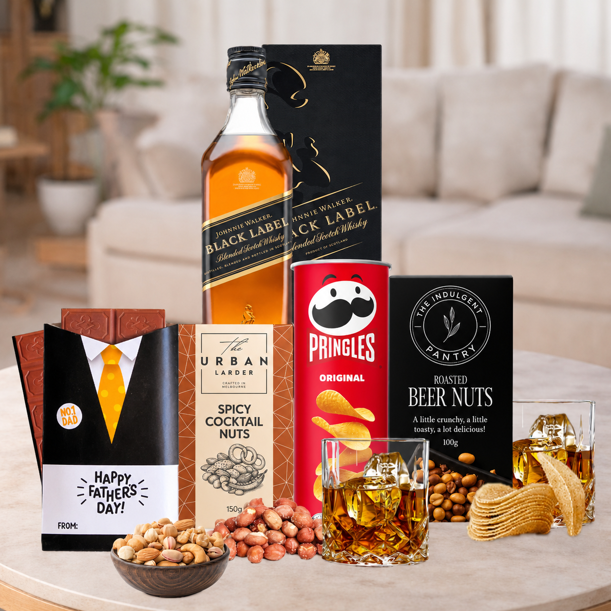 Whisky gift hamper for Dad with Chivas Regal, Jack Daniel's, Johnnie Walker Black, Dimple, gourmet nuts, Pringles and Father's Day chocolates.